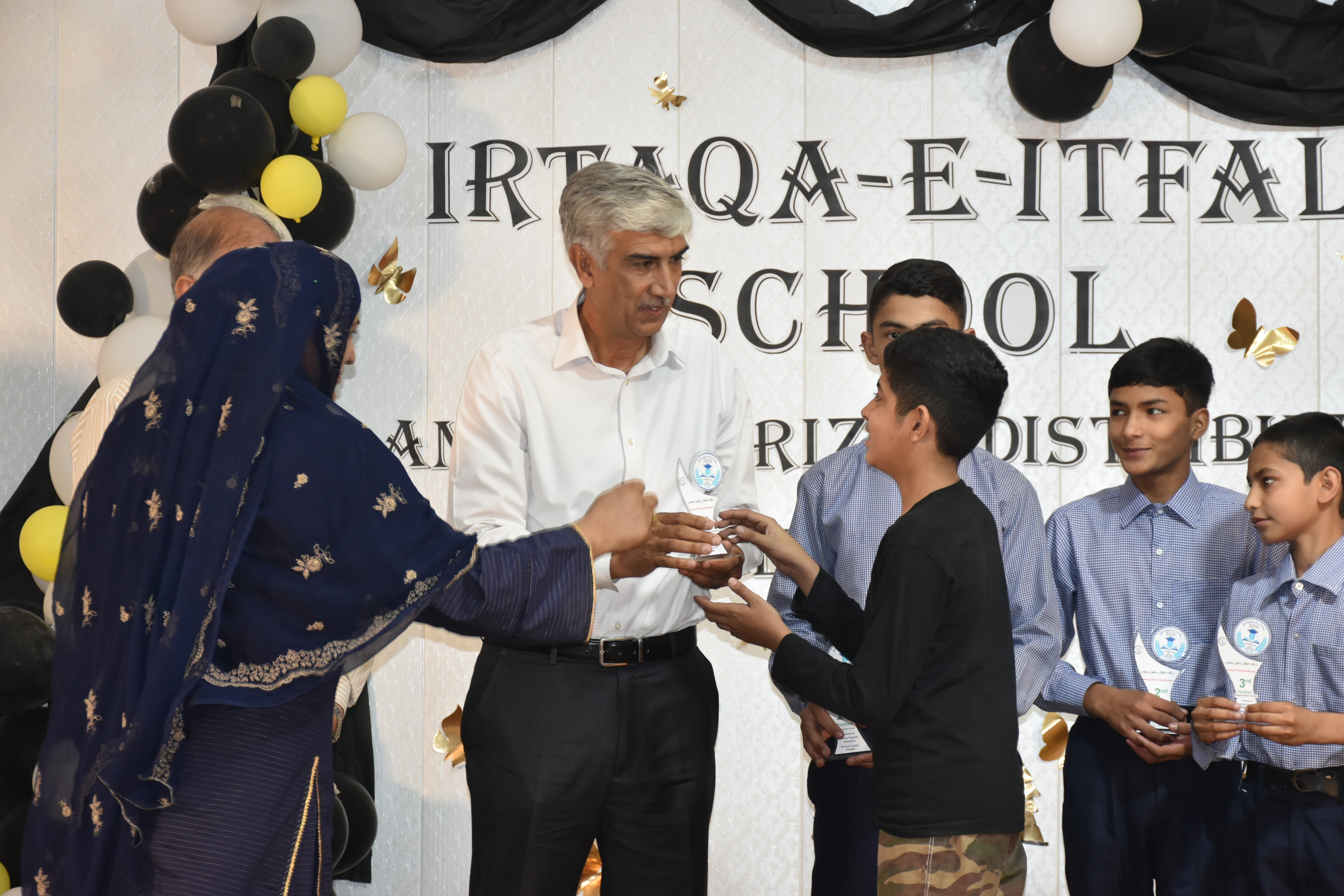 Gul Naz with community members at a Helpline-supported education activity